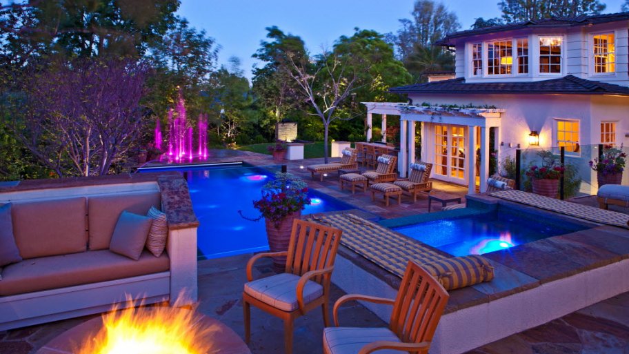 illuminated pool and firepit and water feature
